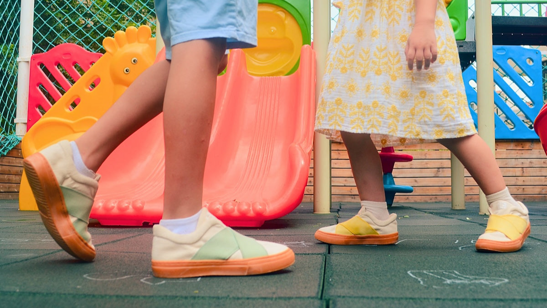 kids wearing Little Fierce sustainable sneakers in a playground