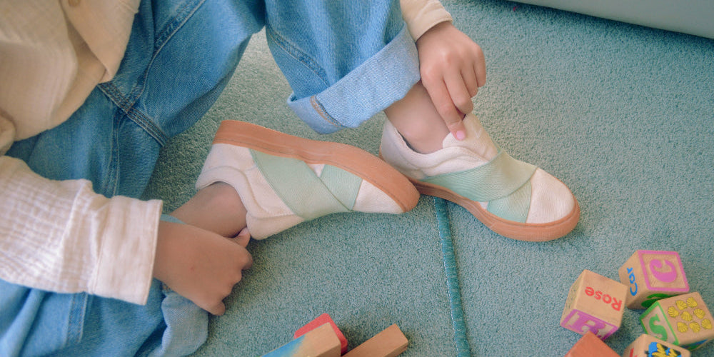 Child wearing colorful sustainable kids shoes